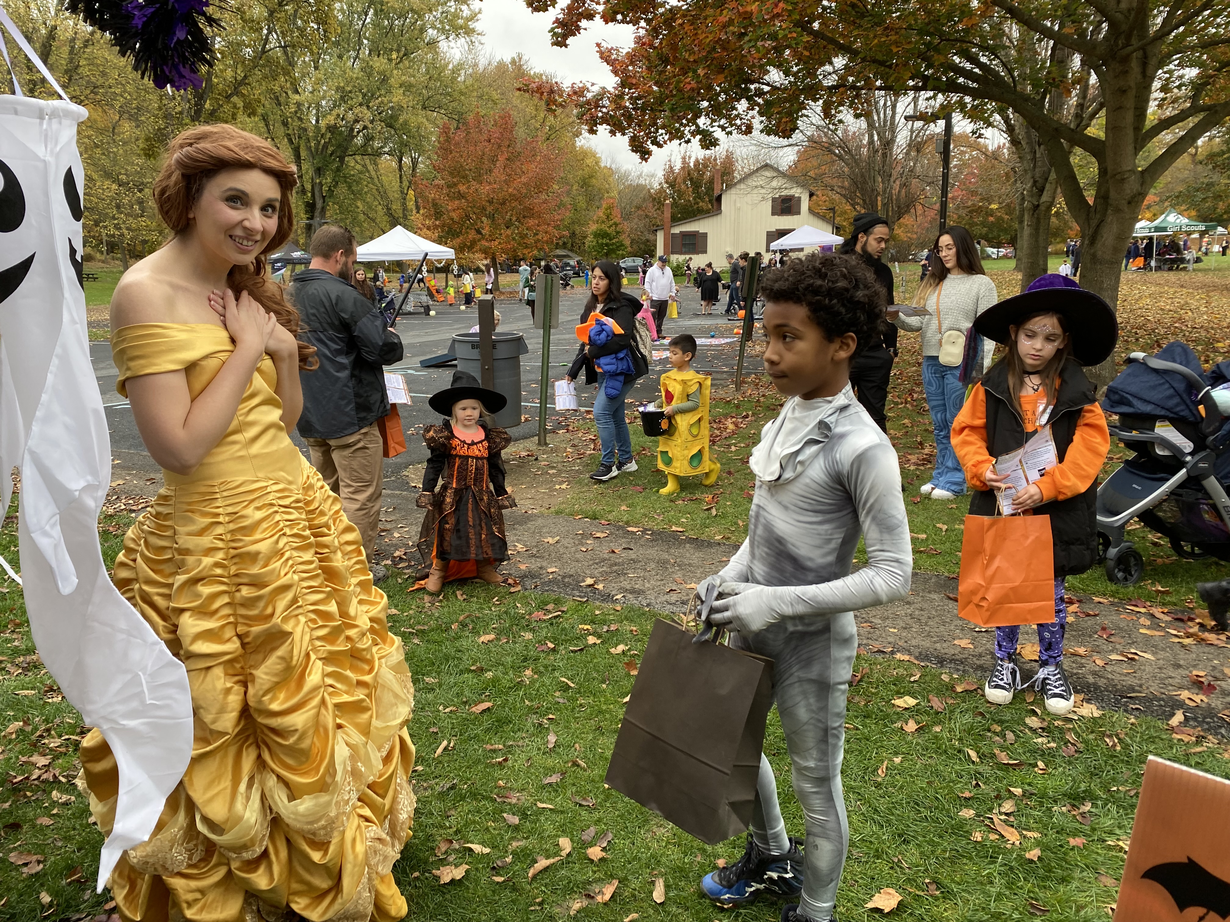 Princess character with kids Trick or Treating nearby