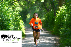 Person running an outdoor race on a trail